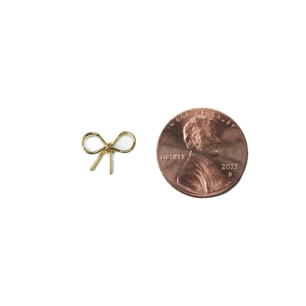 Tiny Thin Bow in Gold